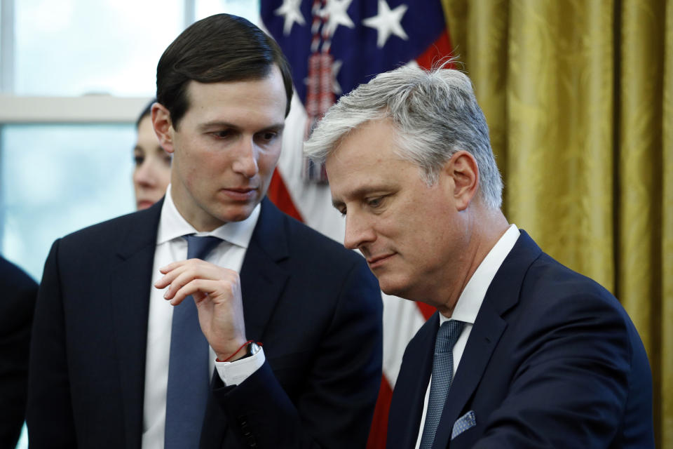 FILE - In this Nov. 13, 2019, file photo, senior adviser Jared Kushner, left, talks with national security adviser Robert O'Brien as President Donald Trump speaks at a news conference with Turkish President Recep Tayyip Erdogan in the East Room of the White House in Washington. (AP Photo/Patrick Semansky, File)