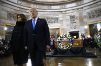 <p>President Donald Trump and first lady Melania Trump walk away after touching a wreath placed by the casket during ceremonies in the U.S. Capitol Rotunda as the remains of the late Rev. Billy Graham lie in honor in Washington, Feb. 28, 2018. (Photo: Jonathan Ernst/Reuters) </p>