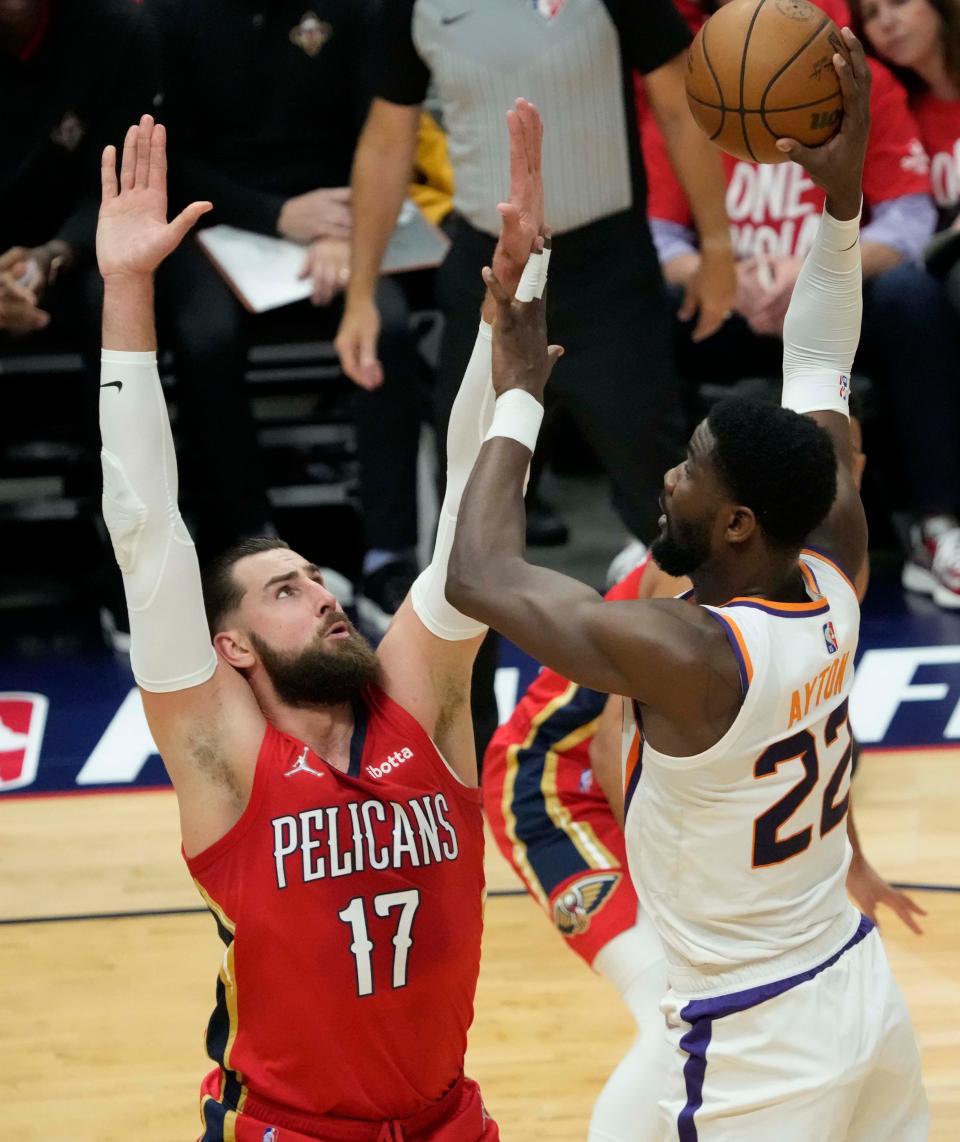 Apr 22, 2022; New Orleans, Louisiana, U.S.;  Phoenix Suns center Deandre Ayton (22) shoots over New Orleans Pelicans center Jonas Valanciunas (17) during Game 3 of the Western Conference playoffs. Mandatory Credit: Michael Chow-Arizona Republic