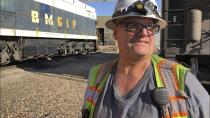 In this Aug. 20, 2019, image, Navajo Generating Station employee and former mayor Lyle Dimbatt answers questions about the planned closure of the coal-fired power plant near Page, Ariz. The power plant will close before the year ends, upending the lives of hundreds of mostly Native American workers who mined coal, loaded it and played a part in producing electricity that powered the American Southwest. (AP Photo/Susan Montoya Bryan)