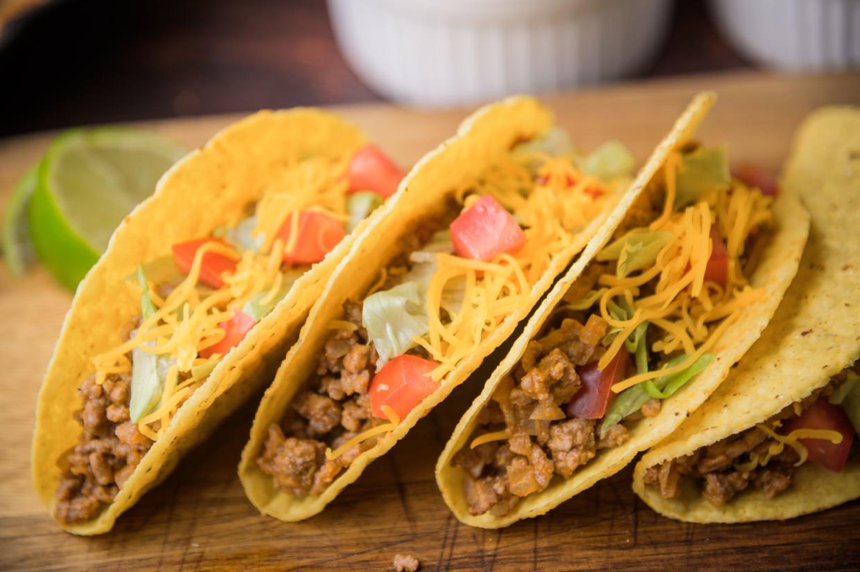 hard shell taco on wooden cutting board