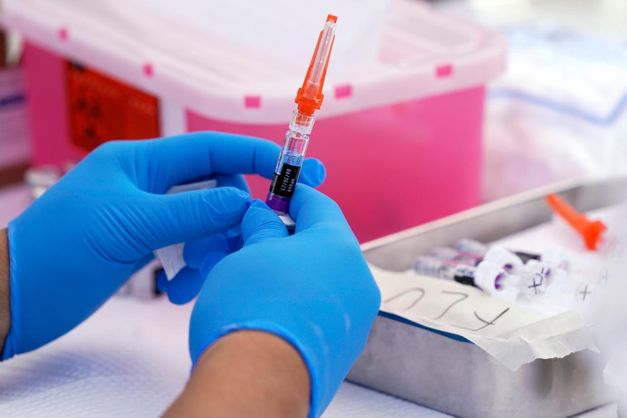 A flu vaccine is readied at the L.A. Care and Blue Shield of California Promise Health Plans' Community Resource Center where they were offering members and the public free flu and COVID-19 vaccines Friday, Oct. 28, 2022, in Lynwood, Calif.