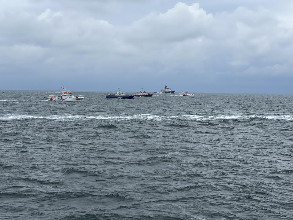 This photo taken on Tuesday, Oct. 24, 2023 in the region of the island Helgoland, in the North Sea and provided by the Seenotretter - DGzRS, shows the search for the missing seamen of the freighter 'Verity', which sank after a collision early Tuesday. German authorities say two cargo ships have collided in the North Sea off the German coast and one vessel sank. At least one sailor died and rescuers were trying to find another four. Germany’s Central Command for Maritime Emergencies said the Polesie and Verity ships collided early Tuesday about 22 kilometers or 14 miles southwest of the island of Helgoland. (Seenotretter - DGzRS via AP)
