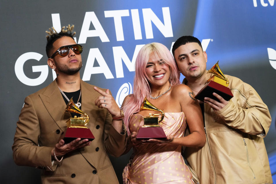 Ovy On The Drums, from left, Karol G, and Kevyn Mauricio Cruz pose with the award for album of the year for "Mañana Sera Bonito" during the 24th annual Latin Grammy Awards in Seville, Spain, Thursday, Nov. 16, 2023. (Photo by Jose Breton/Invision/AP)