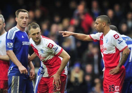 Chelsea defender John Terry (L) and Queens Park Rangers defender Anton Ferdinand during a match at Stamford Bridge in west London on April 29, 2012. Terry arrived in court on Monday for his trial on charges of racially abusing Ferdinand during a football match in 2011