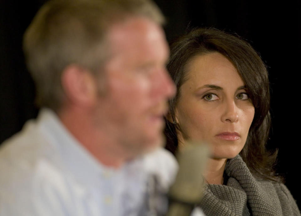 <p>With his wife Deanna at his side, Green Bay Packers quarterback Brett Favre talks about his retirement Thursday March 6, 2008 during a press conference at Lambeau Field in Green Bay, Wis. (AP Photo/Mike Roemer)</p>