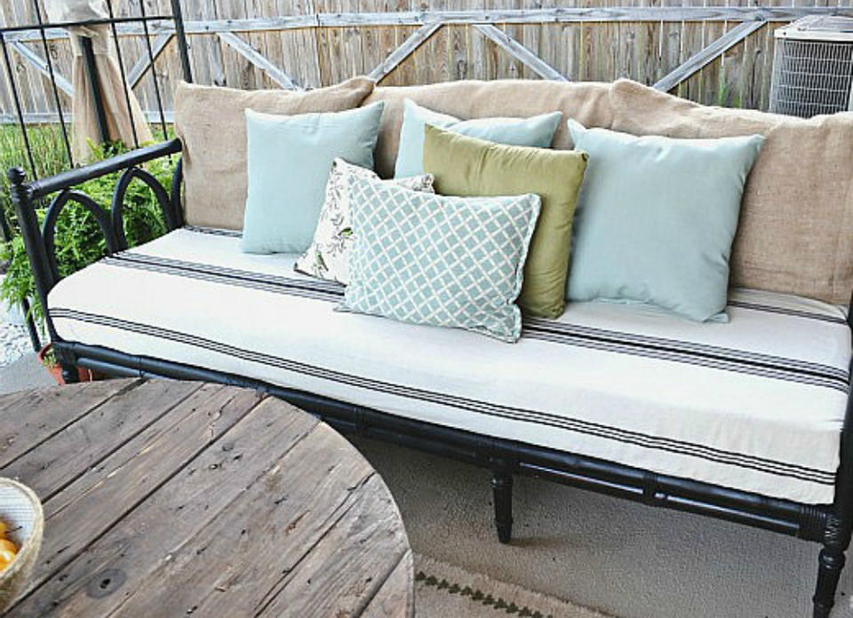 <body> <p>As it turns out, it didn’t take too much to uncover this sofa's potential. While the frame was in excellent shape, it was in desperate need of a fresh coat of <a rel="nofollow noopener" href=" http://www.bobvila.com/slideshow/the-most-taboo-color-infiltrates-home-design-48145?bv=yahoo" target="_blank" data-ylk="slk:black paint;elm:context_link;itc:0;sec:content-canvas" class="link ">black paint</a>. The cushions received an easy upgrade with a tablecloth reborn as a slipcover. A few decorative throw pillows later, this bargain find was successfully revamped into a stylish outdoor couch. </p> <p><strong>Related: <a rel="nofollow noopener" href=" http://www.bobvila.com/slideshow/7-ideas-to-steal-from-real-people-s-tiny-backyards-49159?bv=yahoo" target="_blank" data-ylk="slk:7 Ideas to Steal from Real People’s Tiny Backyards;elm:context_link;itc:0;sec:content-canvas" class="link ">7 Ideas to Steal from Real People’s Tiny Backyards</a> </strong> </p> </body>