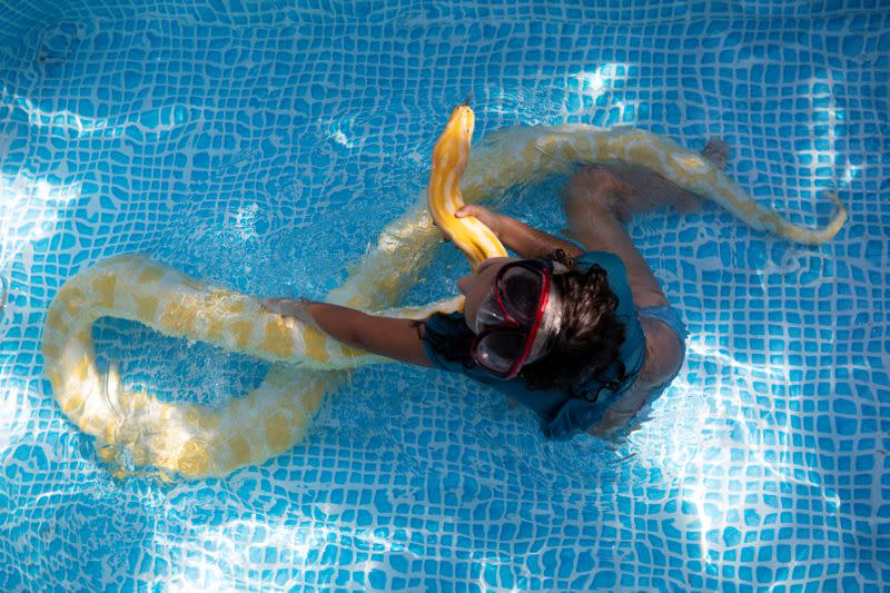 Israeli girl makes a splash with her pet snake