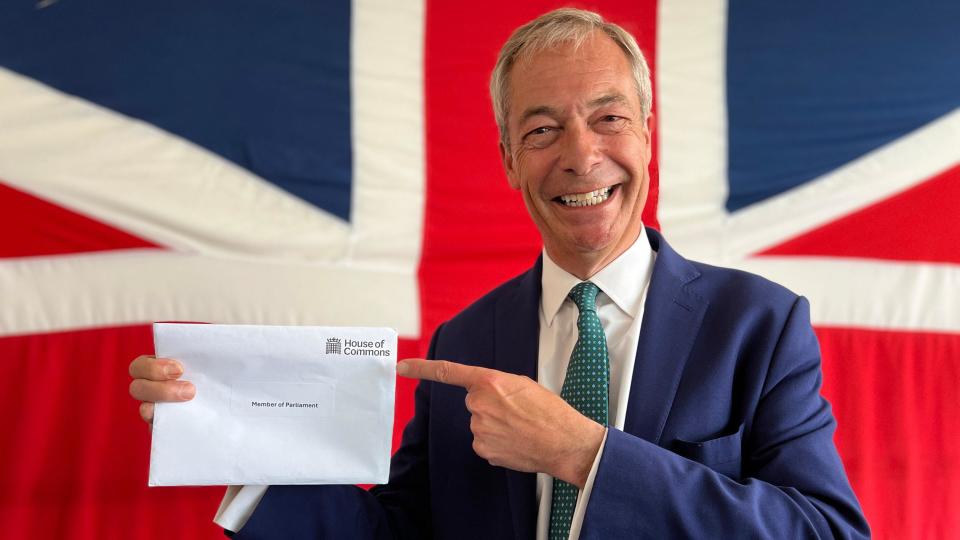 Nigel Farage holding an envelope welcoming him to the House of Commons