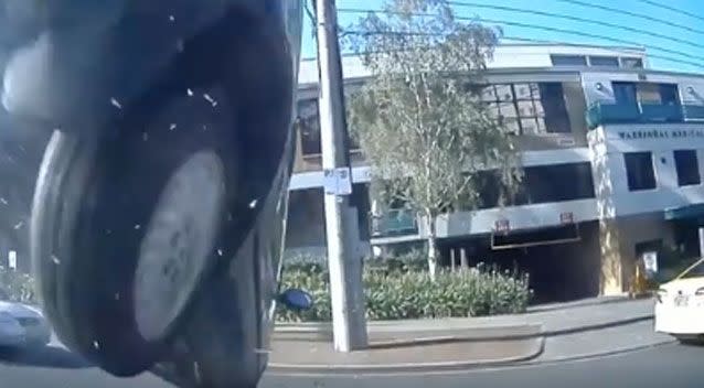 The vehicle flies over the parked car after smashing into its bonnet. Photo: Facebook/ Dash Cam Owners Australia