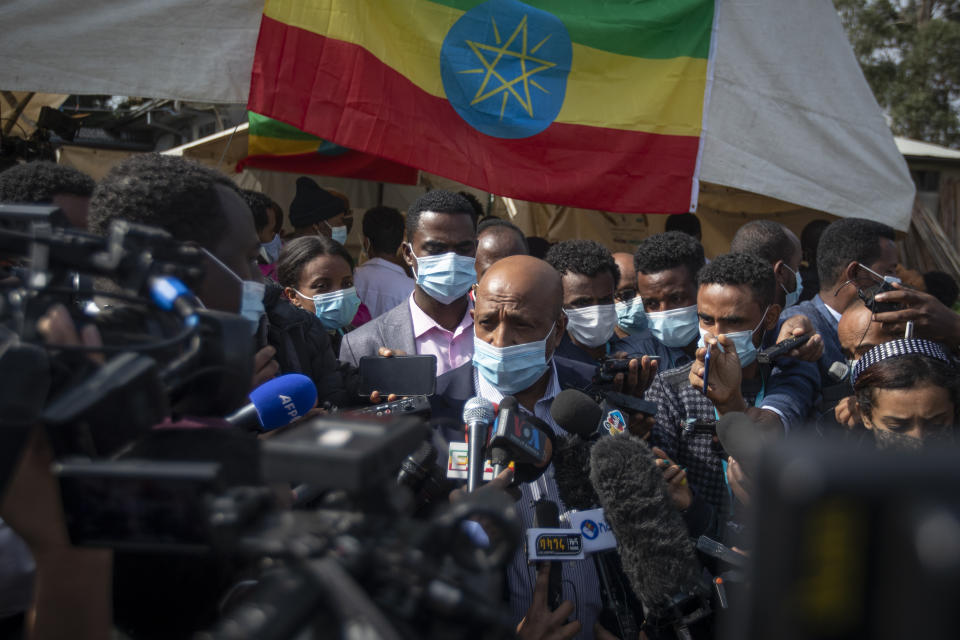 Berhanu Nega, leader of the Ethiopian Citizens for Social Justice (EZEMA) opposition party, speaks to the media after casting his vote in the general election at a polling center in the capital Addis Ababa, Ethiopia Monday, June 21, 2021. Ethiopia was voting Monday in the greatest electoral test yet for Prime Minister Abiy Ahmed as insecurity and logistical issues meant ballots wouldn't be cast in more than 100 constituencies of the 547 across the country. (AP Photo/Ben Curtis)