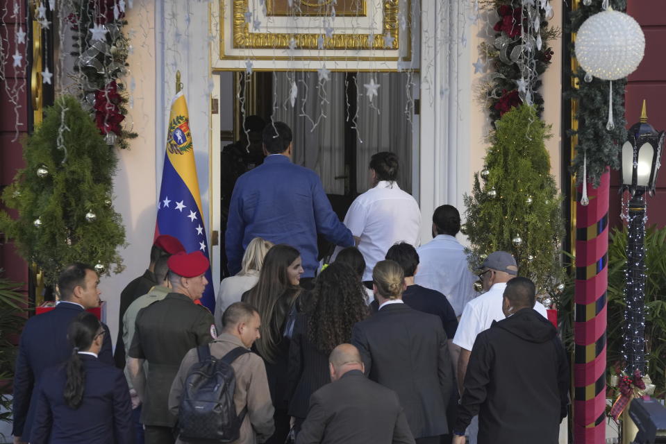 Venezuelan President Maduro, top left, escorts Alex Saab into Miraflores presidential palace after Saab arrived to Caracas, Venezuela, Wednesday, Dec. 20, 2023. The United States freed Saab, who was arrested on a U.S. warrant for money laundering in 2020, in exchange for the release of 10 Americans imprisoned in Venezuela, U.S. officials said Wednesday. (AP Photo/Matias Delacroix)