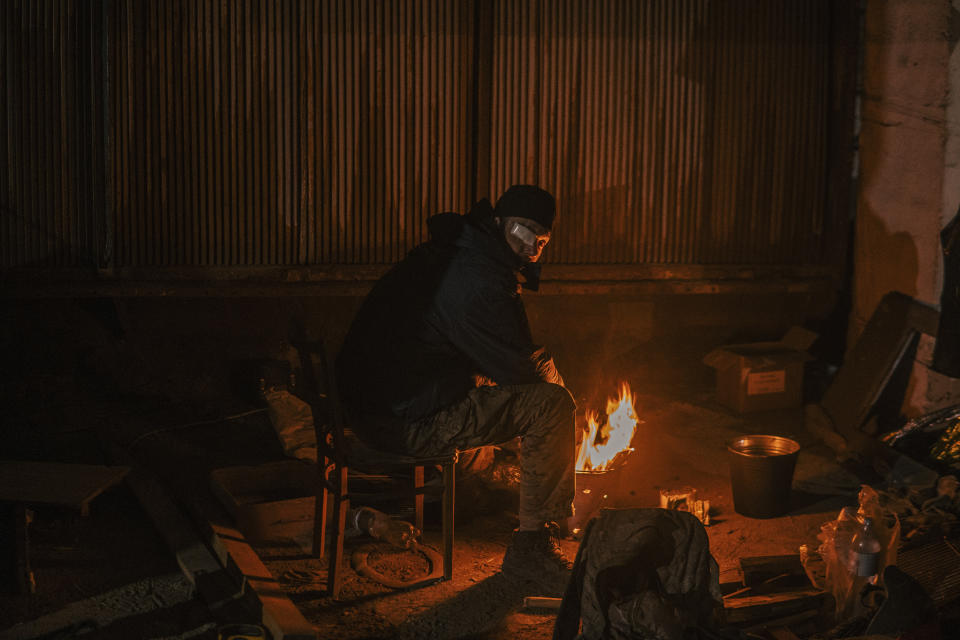 In this photo provided by Azov Special Forces Regiment of the Ukrainian National Guard Press Office, A Ukrainian soldier inside the ruined Azovstal steel plant take a rest in his shelter in Mariupol, Ukraine, May 7, 2022. For nearly three months, Azovstal’s garrison clung on, refusing to be winkled out from the tunnels and bunkers under the ruins of the labyrinthine mill. A Ukrainian soldier-photographer documented the events and sent them to the world. Now he is a prisoner of the Russians. His photos are his legacy.(Dmytro Kozatsky/Azov Special Forces Regiment of the Ukrainian National Guard Press Office via AP)