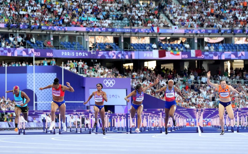 7 photos of Masai Russell's photo finish to win Olympic women's 100m