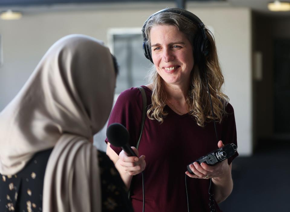 KSL’s Andrea Smardon, podcast producer, interviews an Afghan woman near her apartment in Salt Lake City on Thursday, July 27, 2023. Her identity is not shown to protect her from the Taliban. | Jeffrey D. Allred, Deseret News
