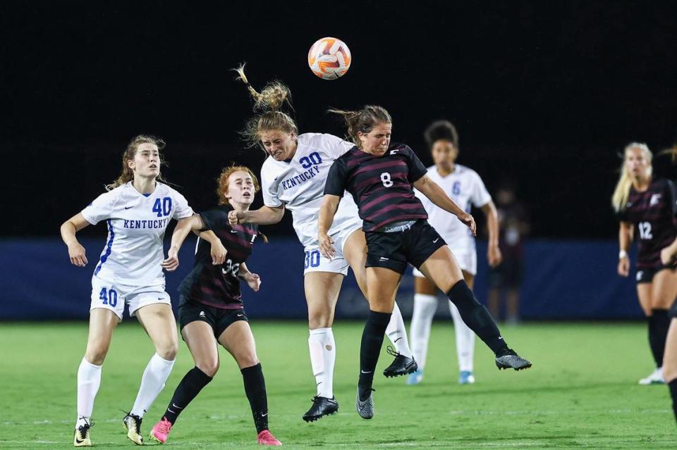 Kentucky graduate student forward Jordyn Rhodes (30) heads the ball against Eastern Kentucky’s Kylie Fitzgerald (8) during their match in Lexington last week. Rhodes singled out her first career goal at Kentucky, scored against Bowling Green in 2019, as one of her most memorable goals as a Wildcat.