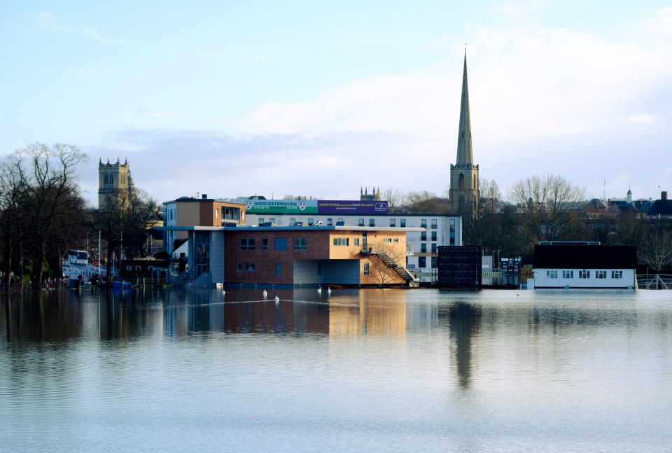 Flooding submerges the city of Worcester as the spire of St Andrew's Church looms in the background.