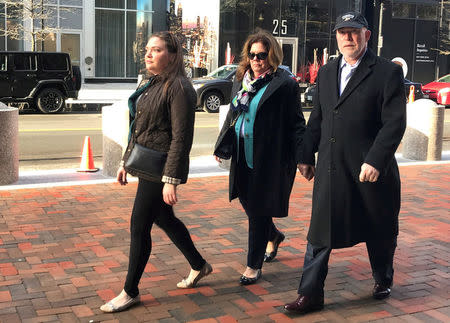 FILE PHOTO: Former Georgeson LLC employee Donna Ackerly, (C), enters the federal courthouse in Boston, Massachusetts, U.S., February 26, 2018. REUTERS/Nate Raymond/File Photo