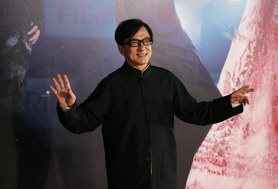 Hong Kong actor Jackie Chan poses on red carpet at Hong Kong Film Awards