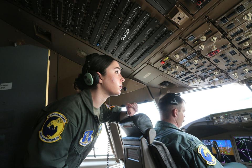 Airman 1st Class Abby Stroup, boom operator with the 157th Operations Group keeps her eye on controls to assist pilot Col. Brian Carloni, commander of the 157th Operations Group in a KC- 46 Pegasus before takeoff Tuesday, June 27, 2023.
