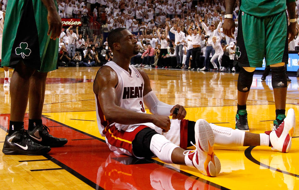 MIAMI, FL - MAY 30: Dwyane Wade #3 of the Miami Heat reacts after he made a basket and drew a foul against Kevin Garnett #5 of the Boston Celtics in overtime of Game Two of the Eastern Conference Finals in the 2012 NBA Playoffs on May 30, 2012 at American Airlines Arena in Miami, Florida. NOTE TO USER: User expressly acknowledges and agrees that, by downloading and or using this photograph, User is consenting to the terms and conditions of the Getty Images License Agreement. (Photo by Mike Ehrmann/Getty Images)