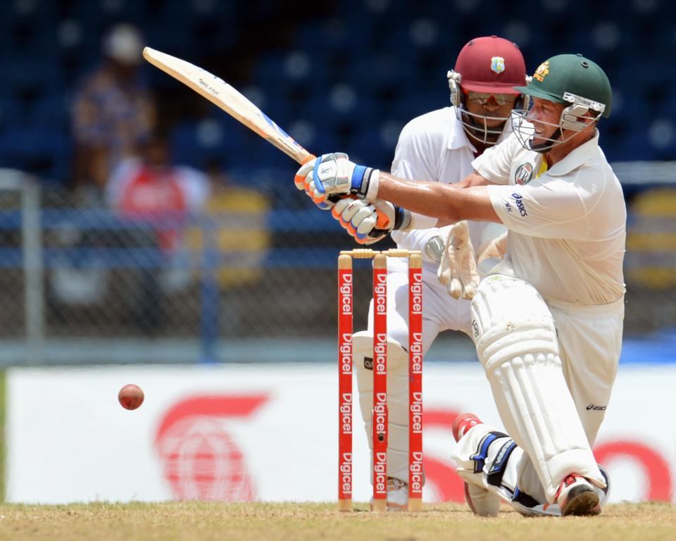Australian batsman Michael Hussey plays a shot during the final day of the second-of-three Test matches between Australia and West Indies April 19, 2012 at Queen's Park Oval in Port of Spain, Trinidad.