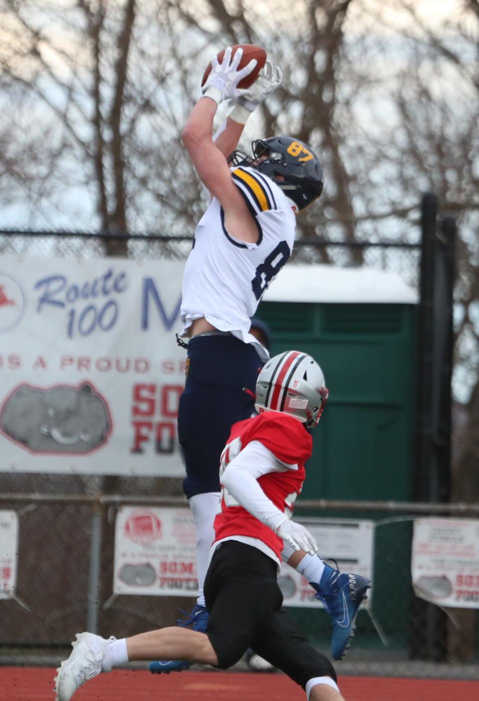 Lourdes' Andrew Rappleyea makes a leaping catch downfield during an April 1, 2021 football game against Somers.