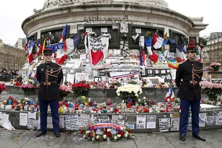 French Republican guards stand during a ceremony at Place de la Republique square to pay tribute to the victims of last year's shooting at the French satirical newspaper Charlie Hebdo, in Paris, France, January 10, 2016. REUTERS/Yohan Valat/Pool/Files
