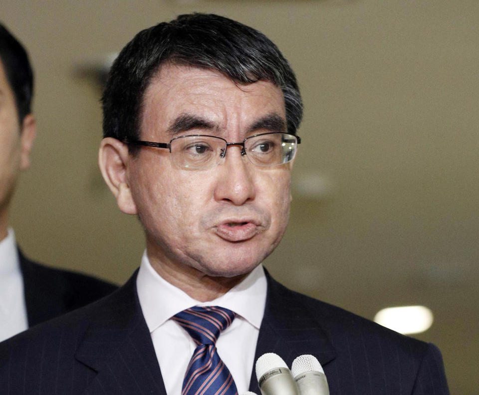 Japan's Foreign Minister Taro Kono speaks to reporters at foreign ministry in Tokyo Wednesday, Oct. 24, 2018. Japan confirmed Wednesday that a man freed from Syria is a Japanese freelance journalist who disappeared three years ago and said he appears to be in good health. (Kyodo News via AP)