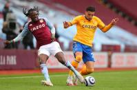 Aston Villa’s Bertrand Traore (left) and Everton’s Ben Godfrey battle for the ball