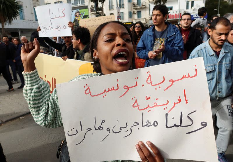 FILE PHOTO: Members of rights groups protest in Tunis