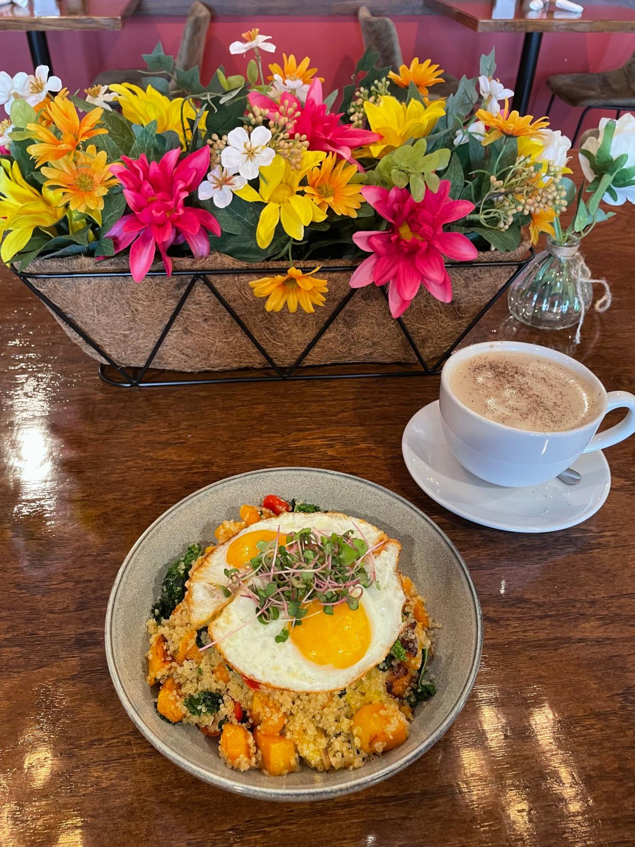 The Tuscan Quinoa Bowl, filled with kale sautted with quinoa, onions, cherry tomatoes, butternut squash and two fried eggs on top and a cinnamon-topped latte from Brooklyn Organic Kitchen in Mahopac were the best things Lohud Food & Dining Reporter Jeanne Muchnick ate this week. Photographed May 2024