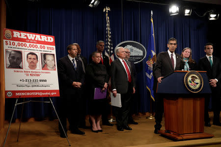 Acting Administrator Uttam Dhillon of the Drug Enforcement Administration (DEA) speaks next to U.S. Attorney General Jeff Sessions (C) at a news conference with other law enforcement officials to announce enforcement efforts against Cartel Jalisco Nueva Generacion (CJNG) at the Justice Department in Washington, U.S., October 16, 2018. REUTERS/Yuri Gripas