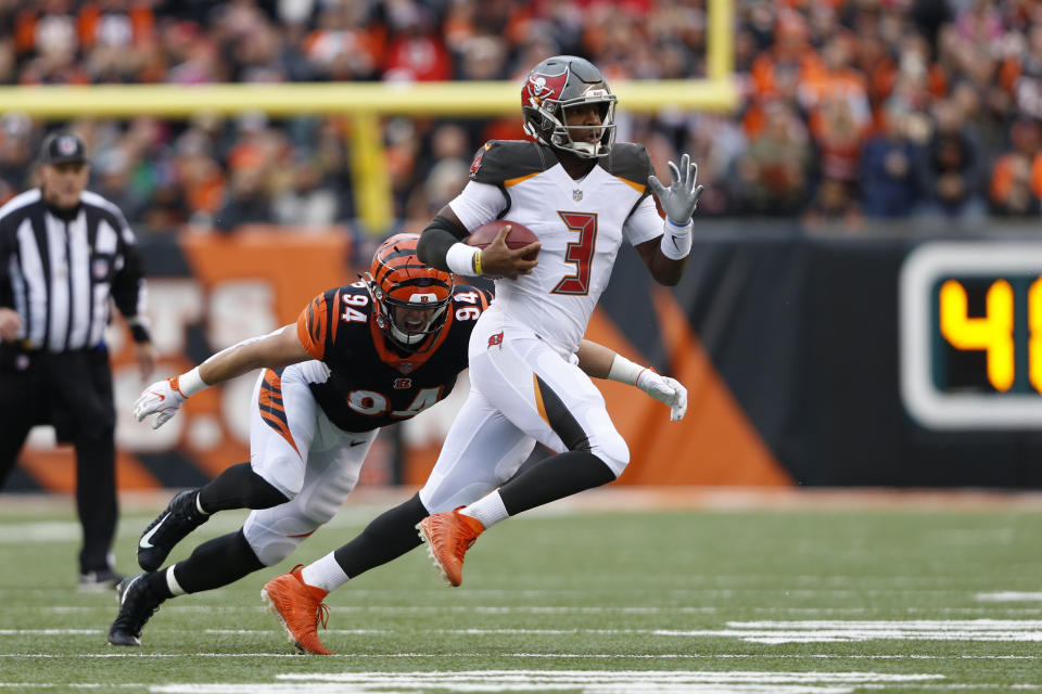 Tampa Bay Buccaneers quarterback Jameis Winston (3) is chased by Cincinnati Bengals defensive end Sam Hubbard (94) during the first half of an NFL football game in Cincinnati, Sunday, Oct. 28, 2018. (AP Photo/Frank Victores)