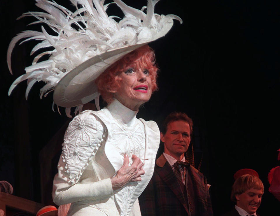 Carol Channing acknowledges applause during the opening night curtain call for the Broadway revival of "Hello Dolly!" in New York on Oct. 19, 1995. The ebullient musical comedy star who delighted American audiences in almost 5,000 performances as the scheming Dolly Levi on Broadway and beyond, died on Jan. 15 at age 97. (AP Photo/Aubrey Reuben)