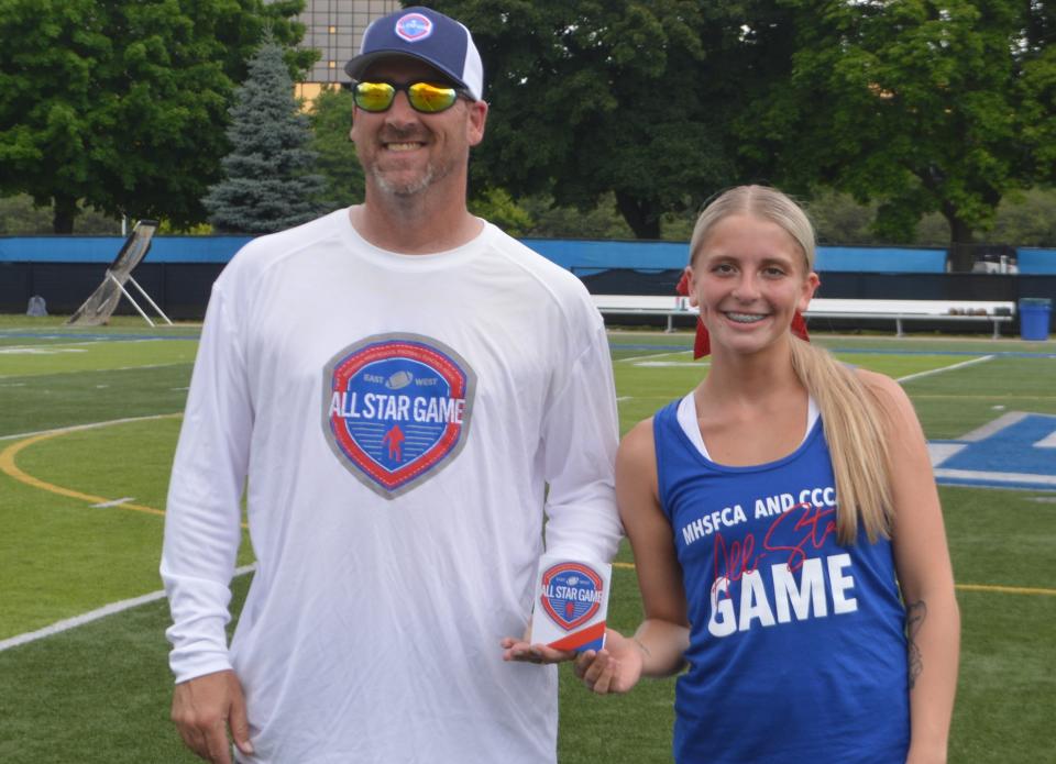 Bedford cheerleader Jocelyn Phillips is honored at halftime of the Michigan High School Football Coaches Association All-Star Game on Saturday, June 22, 2024.