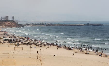 People swim at Ramlet al-Bayda public beach in Beirut