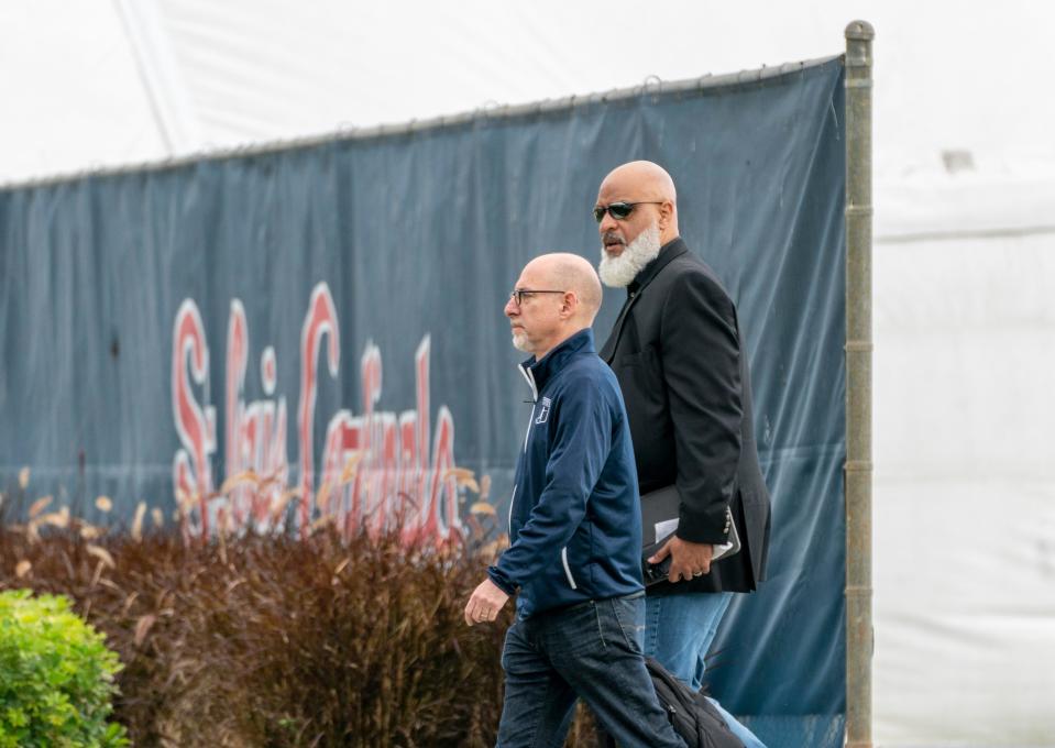 MLB executive director Tony Clark, right, and chief negotiator Bruce Meyer arrive for negotiations Tuesday at Roger Dean Chevrolet Stadium in Jupiter - and left hours later with no agreement.