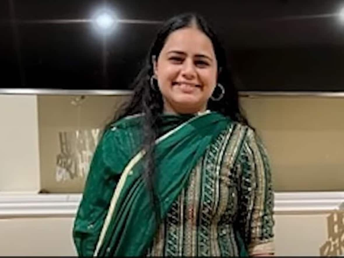 Pawanpreet Kaur, 21, a gas station employee, was fatally shot in Mississauga on Dec. 3, 2022. Police have issued a Canada-wide arrest warrant for her alleged killer. Two other people in New Brunswick, family members of the accused, have been charged with accessories to murder after the fact. (YouTube/Peel Regional Police - image credit)