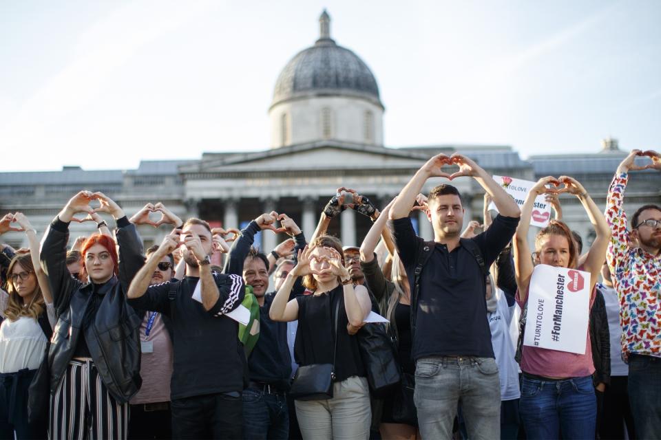 People gather at Trafalgar Square in London in memory of the victims of terror attack at Manchester Arena.