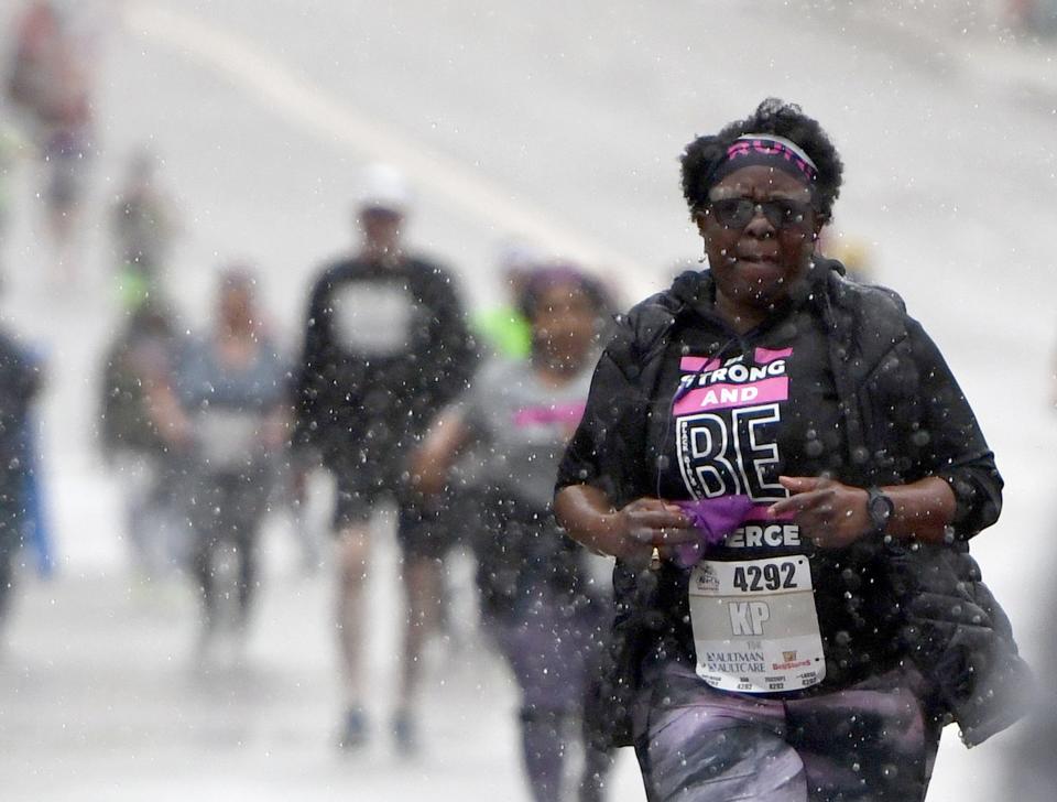 The skies open Sunday morning as rain pours onto runners during the 10th Canton Hall of Fame Marathon.