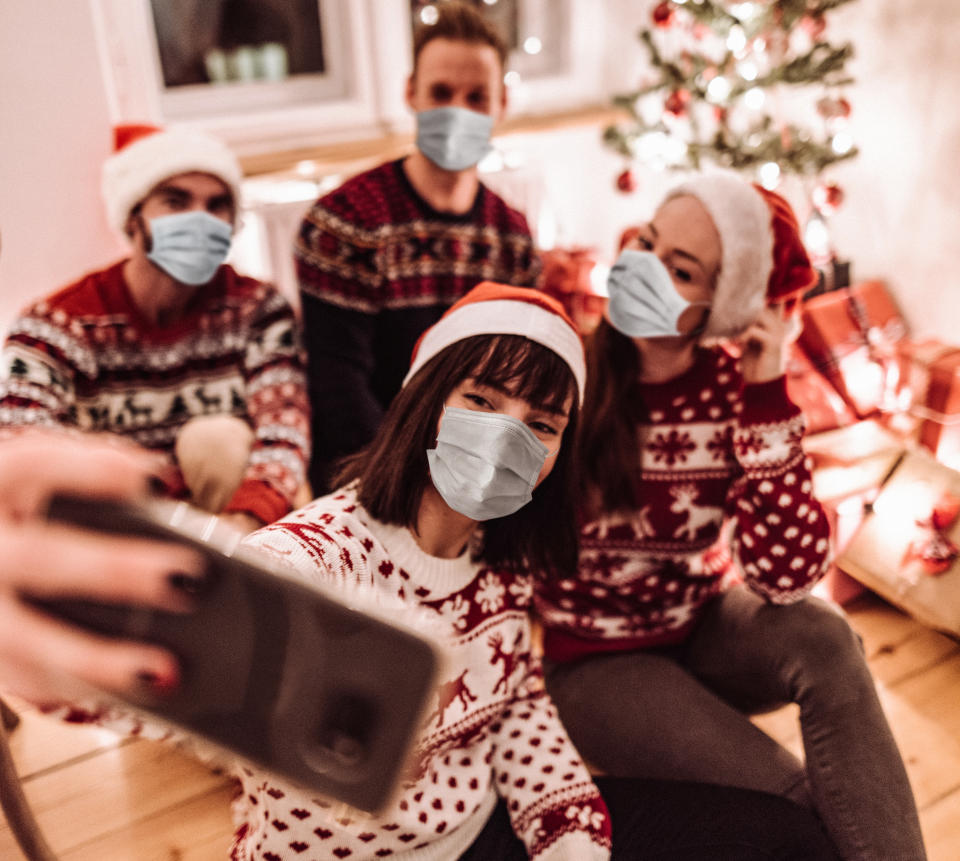 friends take a selfie at christmas during the lockdown