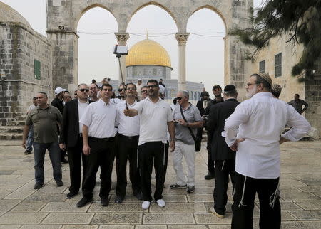Right-wing Jewish activists take a picture of themselves during a visit to the compound known to Muslims as Noble Sanctuary and to Jews as Temple Mount in Jerusalem's Old City May 28, 2015. REUTERS/Ammar Awad
