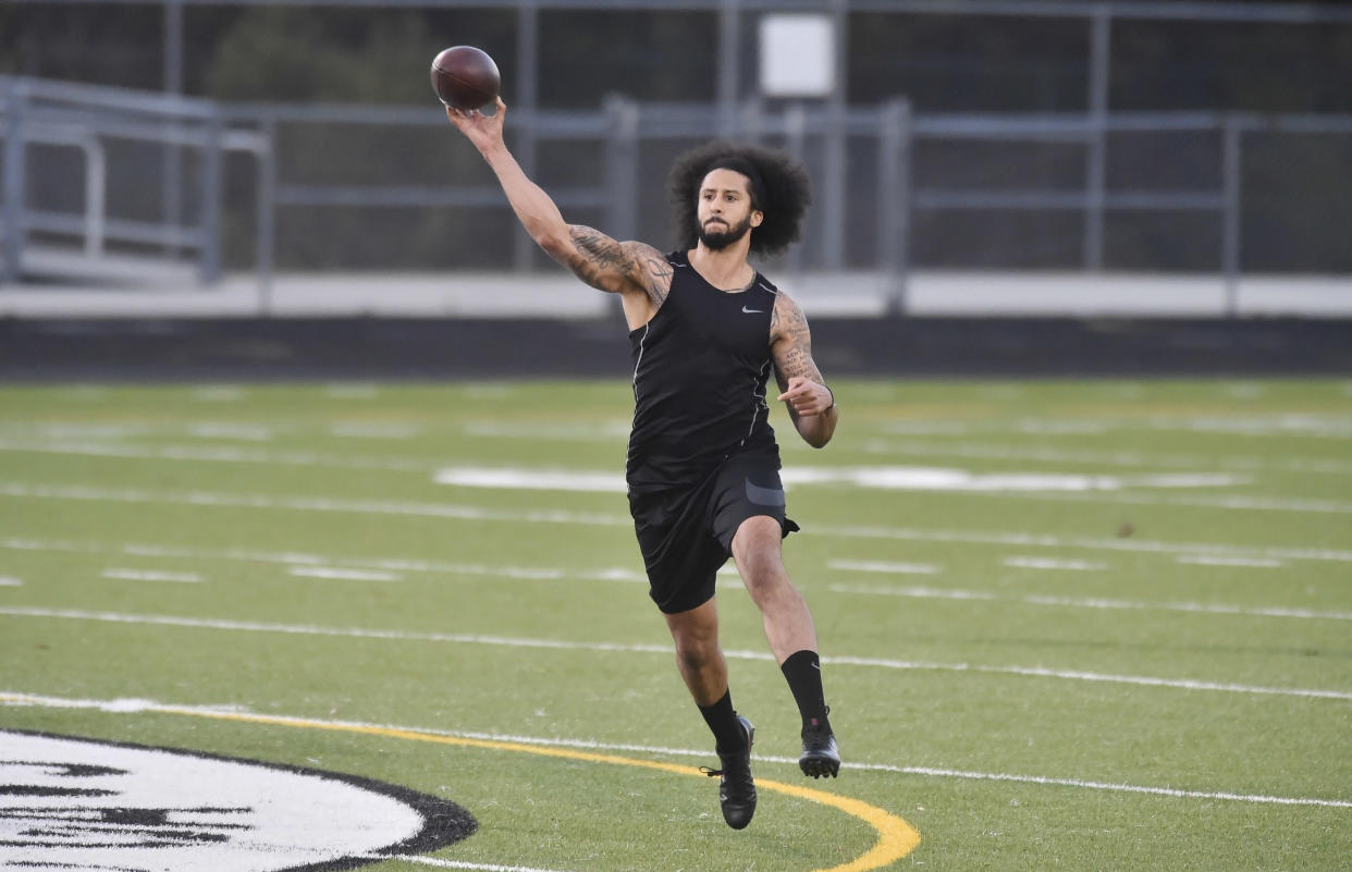RIVERDALE, GA - NOVEMBER 16:  Former NFL quarterback Colin Kaepernick goes through a series of passing drills at Crescent Stadium at Charles R. Drew High School. (Photo by Austin McAfee/Icon Sportswire via Getty Images)