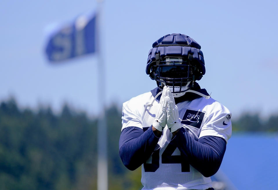 Seattle Seahawks linebacker Bobby Wagner gestures to fans as they shout his name during the NFL football team's training camp Wednesday, July 26, 2023, in Renton, Wash. (AP Photo/Lindsey Wasson)