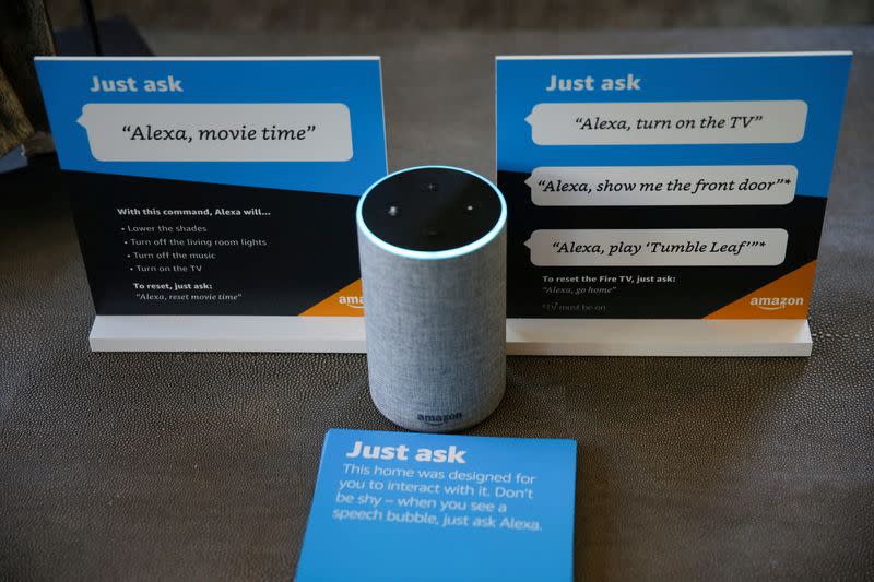 Prompts on how to use Amazon's Alexa personal assistant are seen alongside an Amazon Echo in an Amazon ‘experience center’ in Vallejo