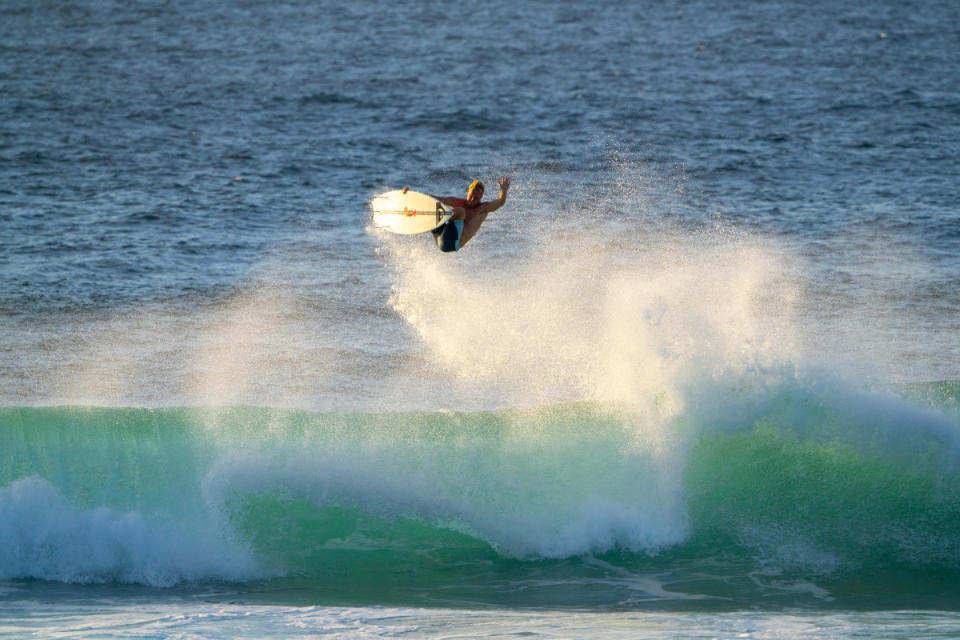 Levi Young levitates into the glow of a Ho'okipa sunset. <p>Matt Cibulka</p>