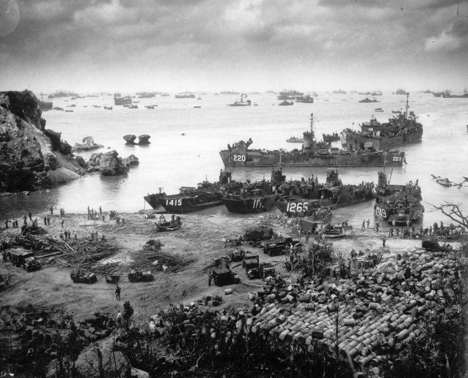 FILE - In this photo provided by the U.S. Coast Guard, U.S. invasion forces establish a beachhead on Okinawa island, about 350 miles from the Japanese mainland, on April 13, 1945. Okinawa on Sunday, May 15, 2022, marks the 50th anniversary of its return to Japan on May 15, 1972, which ended 27 years of U.S. rule after one of the bloodiest battles of World War II was fought on the southern Japanese island. (U.S. Coast Guard via AP, File)