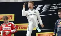 Formula One - Chinese F1 Grand Prix - Shanghai, China - 17/4/16 - Mercedes Formula One driver Nico Rosberg of Germany (C), Red Bull Formula One driver Daniil Kvyat of Russia (R) and Ferrari Formula One driver Sebastian Vettel of Germany after the Chinese Grand Prix. REUTERS/Aly Song