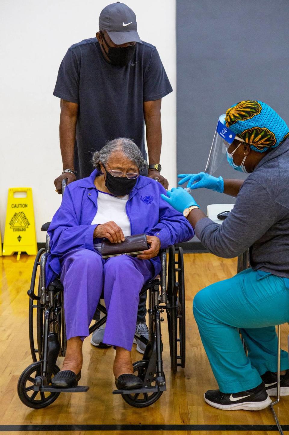 Former educator Nancy Dawkins, 97, who worked for Miami-Dade County Public Schools for over 30 years, registers to receive a vaccine at the new FEMA-supported, state-run COVID-19 vaccine satellite site inside the Samuel K. Johnson Youth Center at Charles Hadley Park in Liberty City, Florida, on Friday, March, 19, 2021.